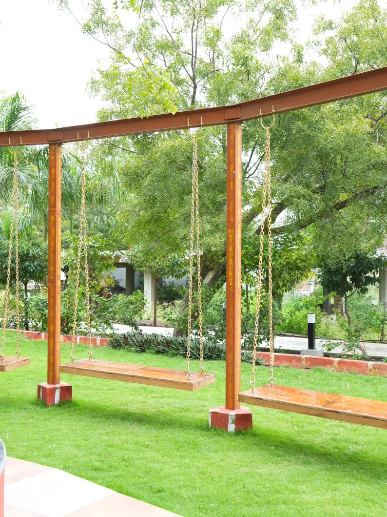Wooden swings on the lawn